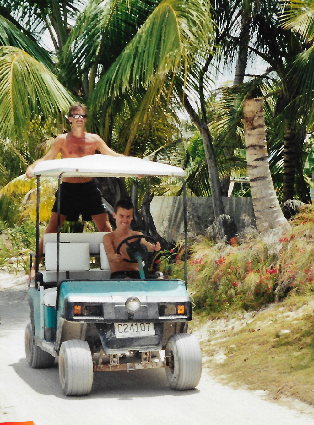 Ryan Casado learning to drive on a golf cart, Marty Casado supervising the lessons, 1999 or so